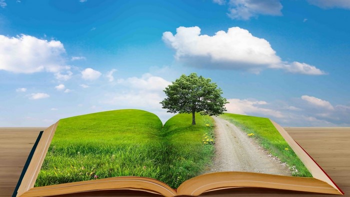 Open book with landscape and tree