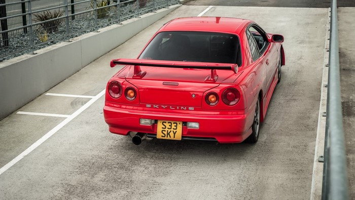 Red Nissan Skyline R34 rear view
