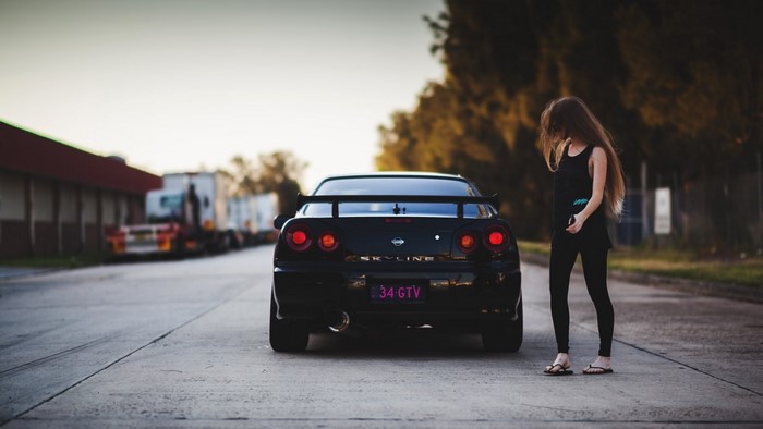 Nissan Skyline GTR with a woman