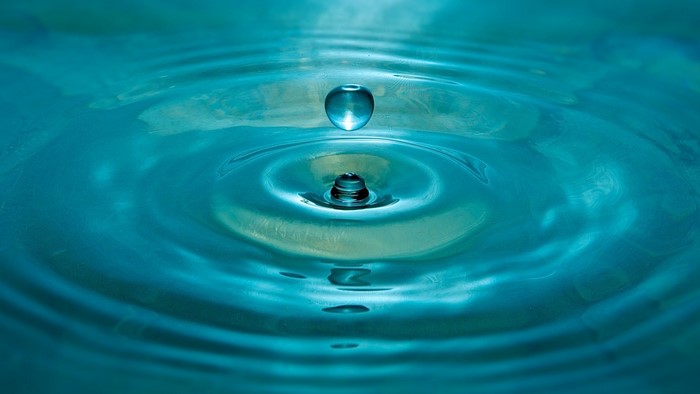 Water drop creating ripples