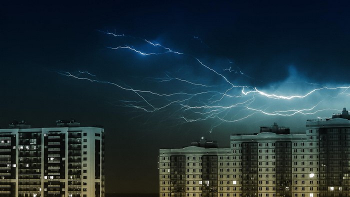 Lightning storm over buildings in Moscow