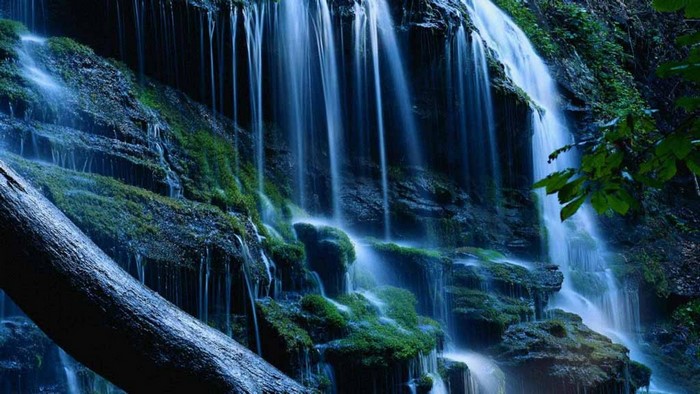 Waterfall cascading over mossy rocks