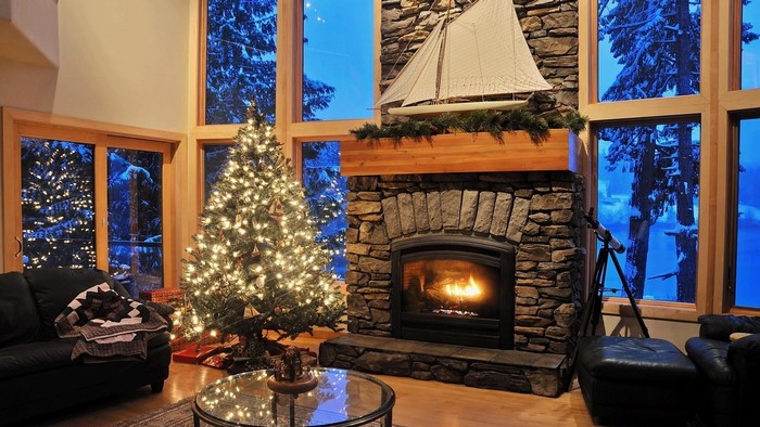 Christmas Tree and Fireplace in Snowy Cabin