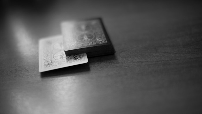 Black and white playing cards on a table