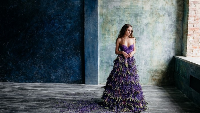 Woman in a purple floral dress