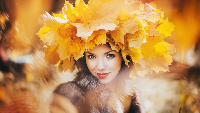 Woman wearing a crown of autumn leaves