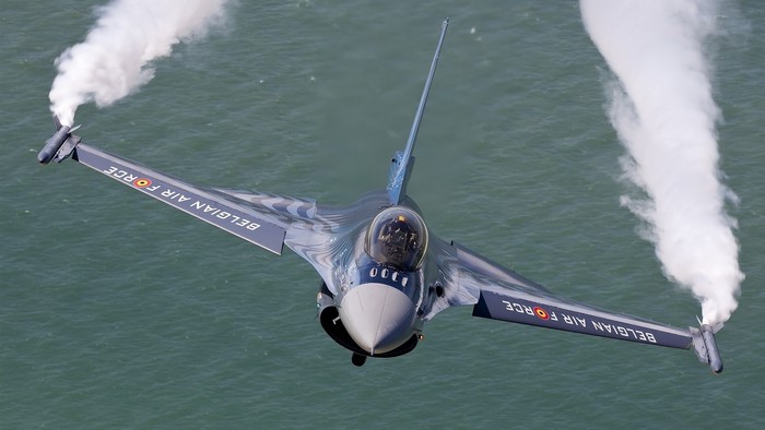 Belgian Air Force F-16 fighter jet performing aerobatics