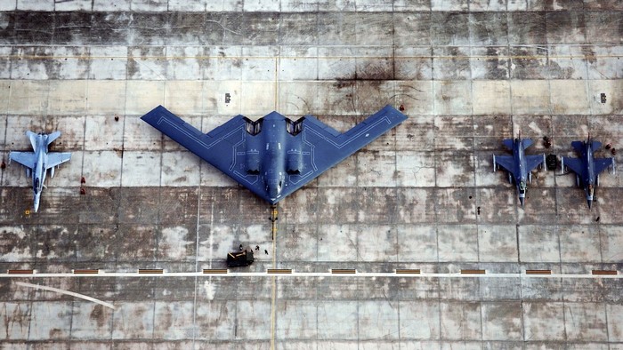B-2 Spirit Bomber and Fighter Jets on Tarmac