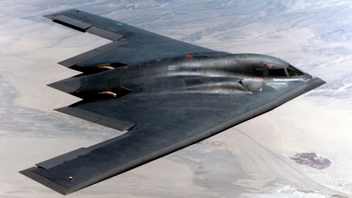 B-2 Spirit Bomber flying over desert