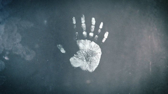 Handprint on a dark surface