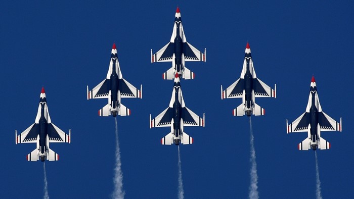 Thunderbirds formation flying in blue sky