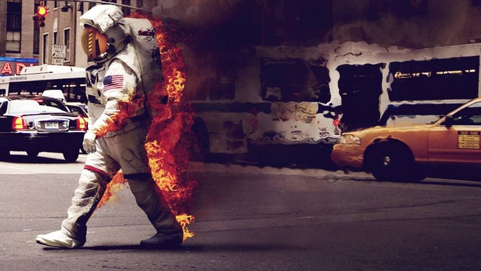Astronaut on Fire in City Street