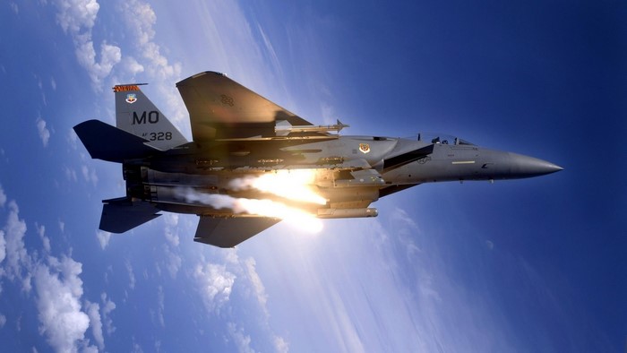 F-15 Eagle fighter jet firing missiles