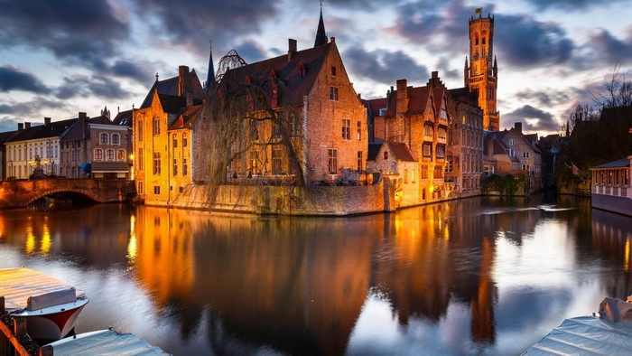 Bruges canal with historic buildings and Belfry tower