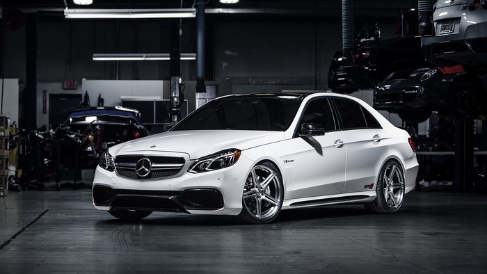 White Mercedes-Benz E63 AMG in a garage