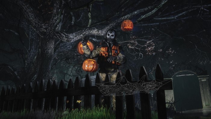 Halloween character with pumpkins in a graveyard