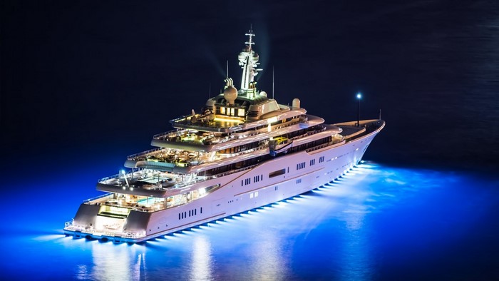 Luxury yacht illuminated at night