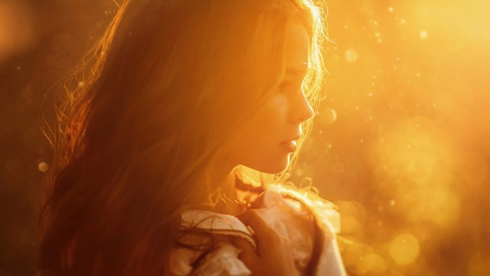 Young girl in golden sunlight