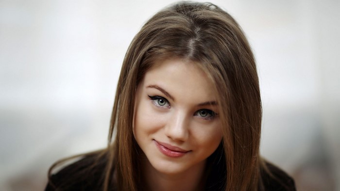 Young woman with brown hair and blue eyes