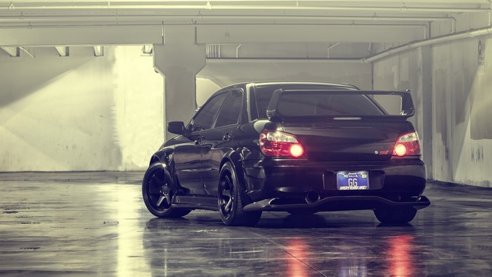Black Subaru Impreza STI in garage