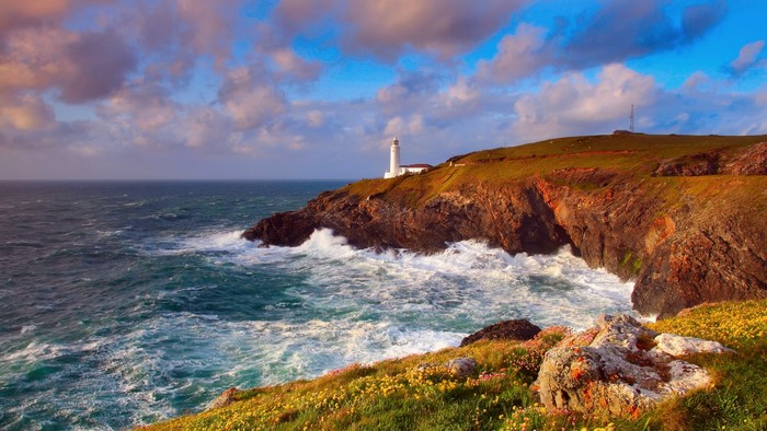 Lighthouse on a cliff overlooking the ocean