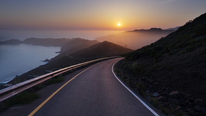 Winding Road by the Ocean at Sunset