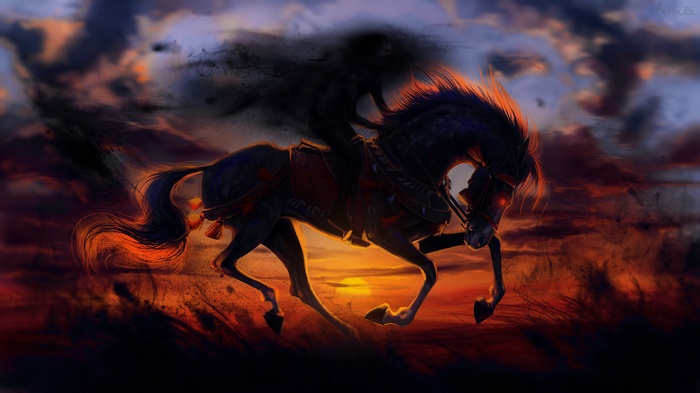 Dark rider on a black horse at sunset