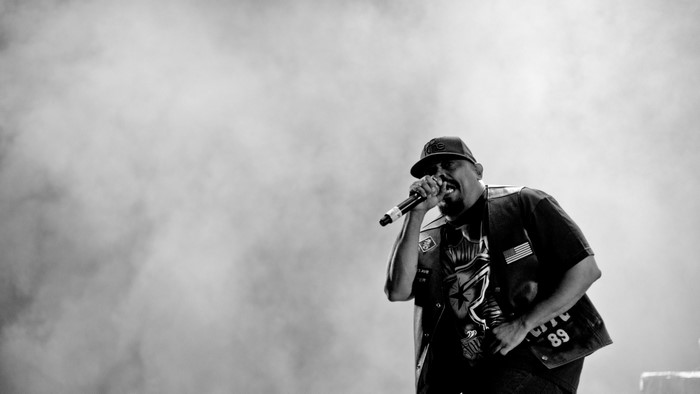 Rapper performing on stage with smoke
