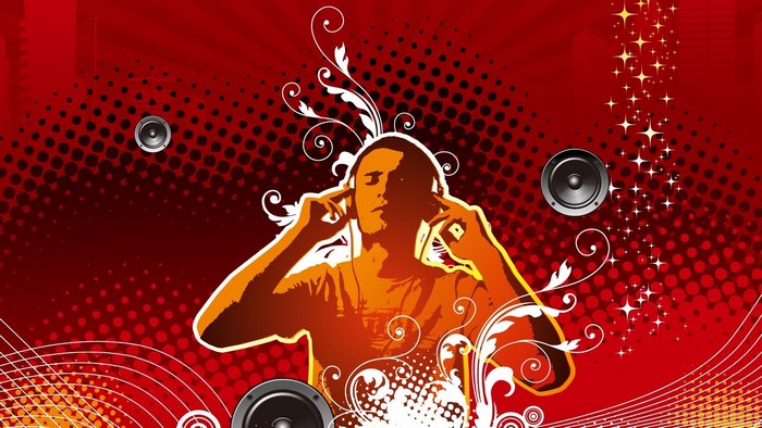Man listening to music with headphones and speakers