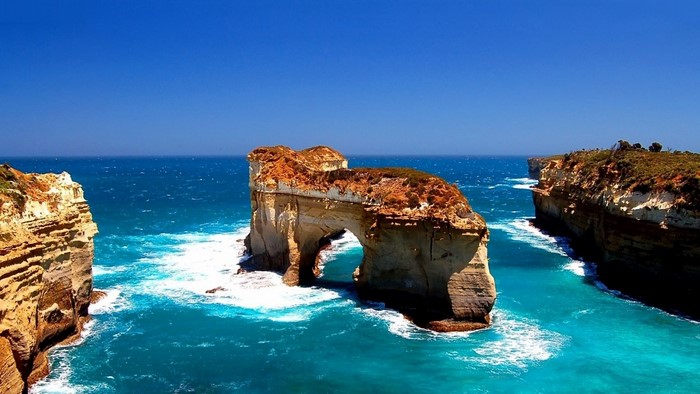 Archway rock formation in the ocean