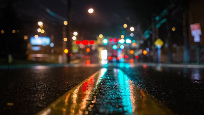 Wet Road at Night with Traffic Lights