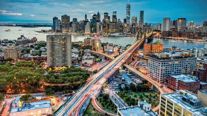 New York City Skyline with Brooklyn Bridge and Car Lights