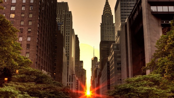 New York City street with sunset between buildings