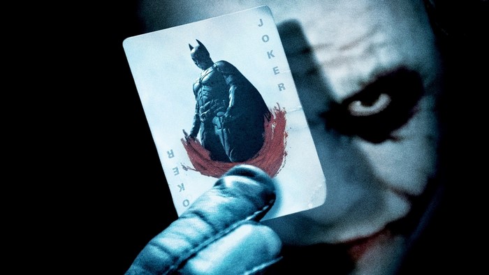 Joker holding Batman card from The Dark Knight