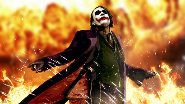 Joker from Batman watching the world burn
