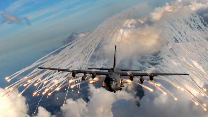 Lockheed C-130 Hercules releasing flares