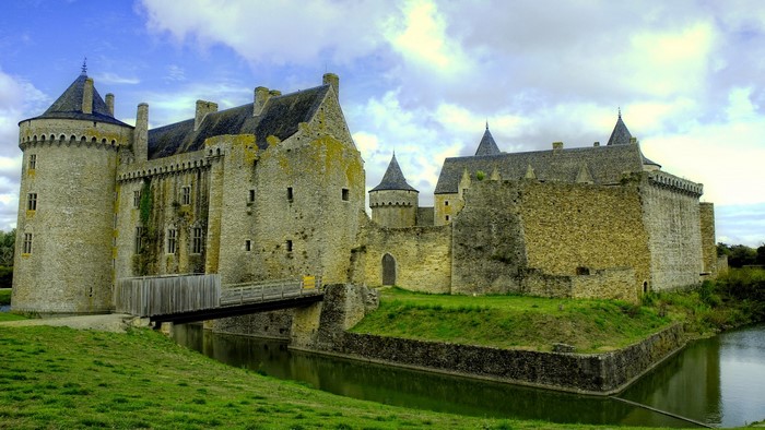 Ancient stone castle with moat and bridge