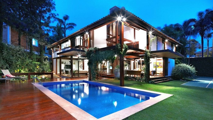 Modern house with swimming pool at dusk