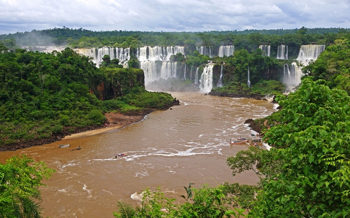 Iguazu Falls with boats on the river