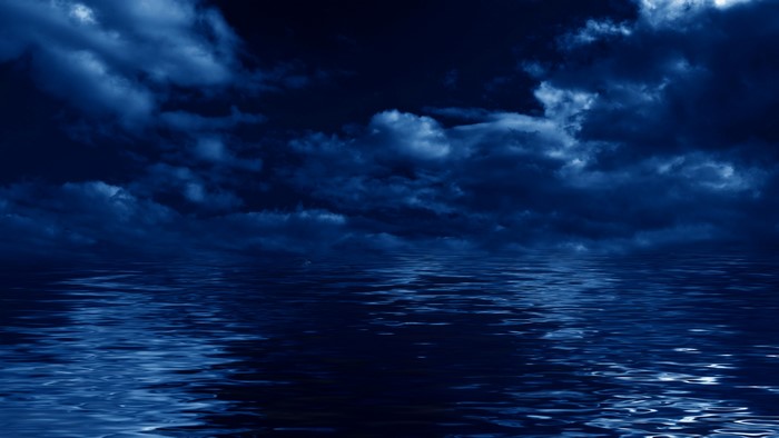 Dark Clouds Over Reflective Water