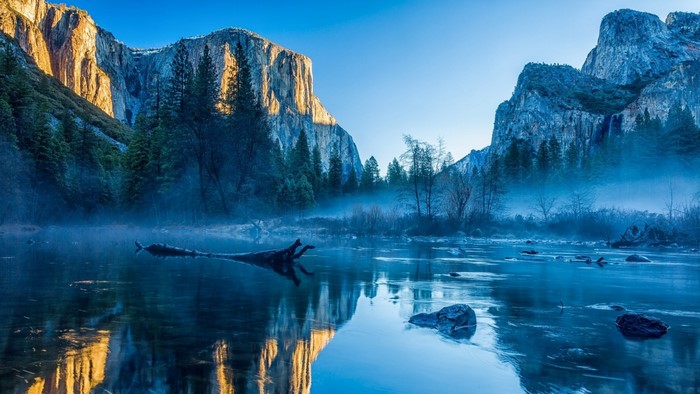Mountains and river with fog