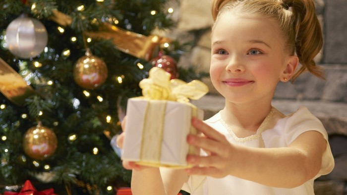 Girl holding a Christmas gift