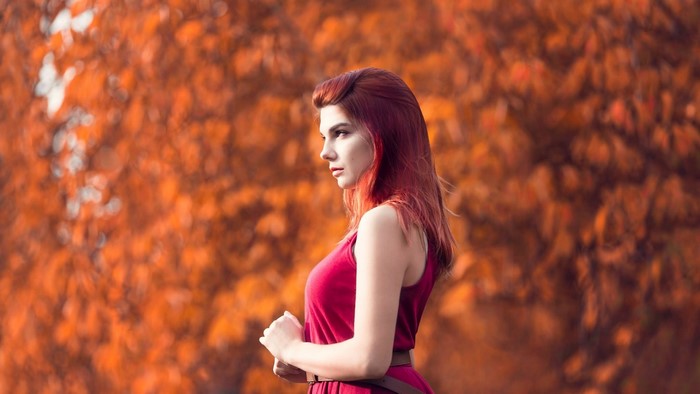 Woman with red hair in a red dress