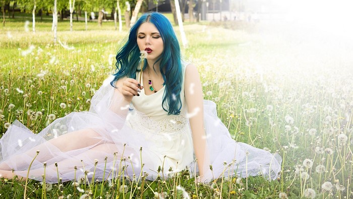 Anastasia Kravchenko in a field of dandelions