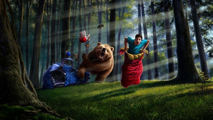 Man in sleeping bag chased by bear in forest