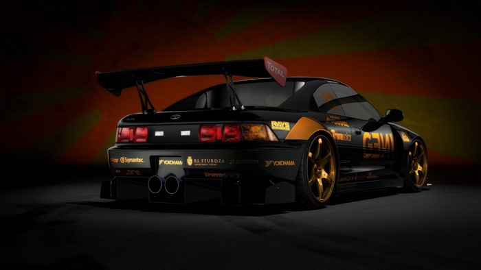 Black Toyota MR2 with gold accents and large spoiler