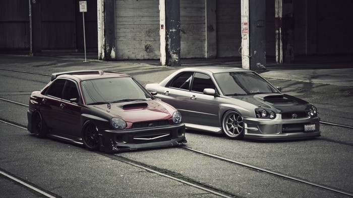 Two Subaru Impreza STI cars on street