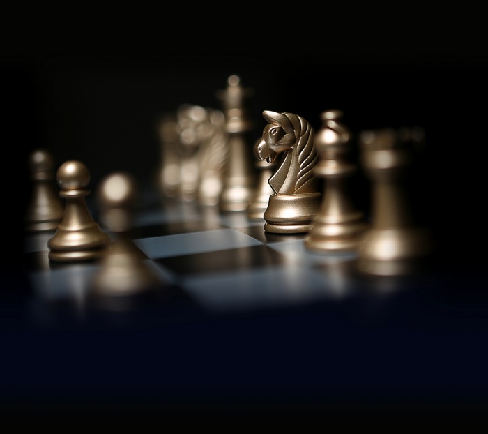Golden Chess Pieces on a Chessboard