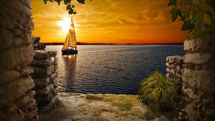 Sailboat on a lake at sunset