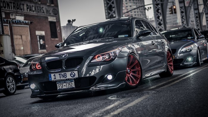 BMW M5 cars on a city street